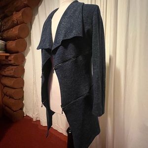 Long dark blue coat with zippers. Used.